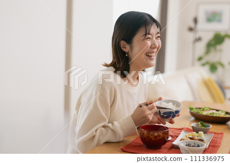 Woman eating: Japanese woman in her 40s Woman eating: Japanese woman in her 40s 111336975