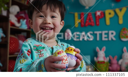 Smiling Asian boy holds an Easter egg 111337105