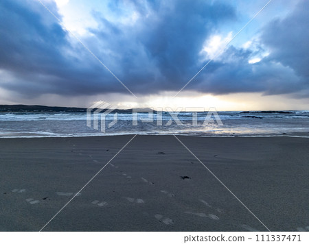 Dramatic clouds at Carrickfad by Portnoo at Narin Strand in County Donegal Ireland 111337471