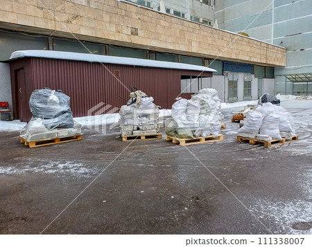 Several wooden pallets with construction waste prepared for removal Several wooden pallets with construction waste prepared for removal 111338007