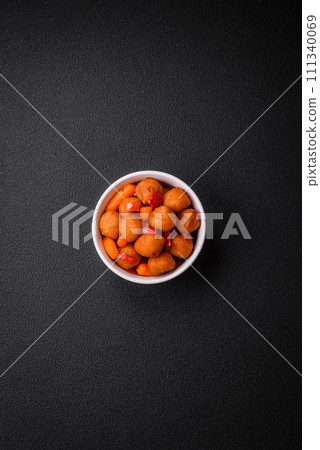 Delicious fried potato balls with vegetables, salt, spices and herbs 111340069