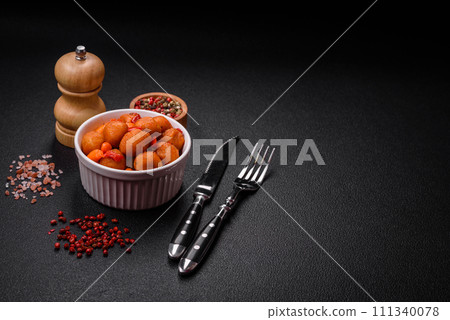 Delicious fried potato balls with vegetables, salt, spices and herbs Delicious fried potato balls with vegetables, salt, spices and herbs 111340078