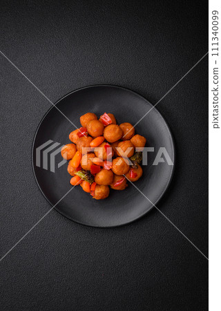Delicious fried potato balls with vegetables, salt, spices and herbs Delicious fried potato balls with vegetables, salt, spices and herbs 111340099