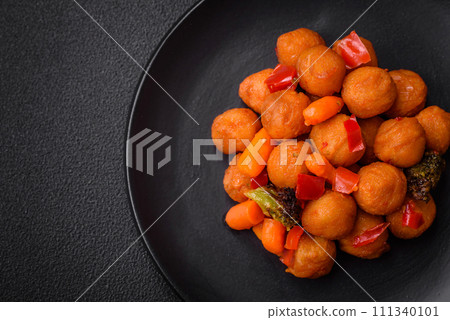 Delicious fried potato balls with vegetables, salt, spices and herbs 111340101