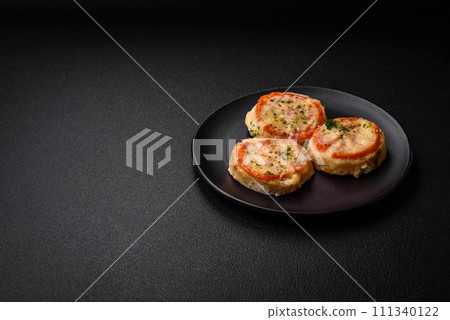 Delicious baked fish fillet with cheese, tomatoes, salt, spices and herbs 111340122