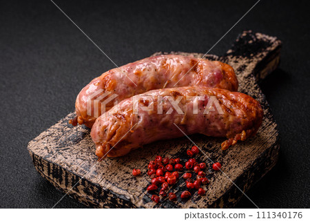 Delicious grilled chicken or pork sausages with salt and spices 111340176
