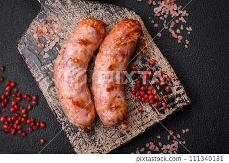 Delicious grilled chicken or pork sausages with salt and spices 111340181
