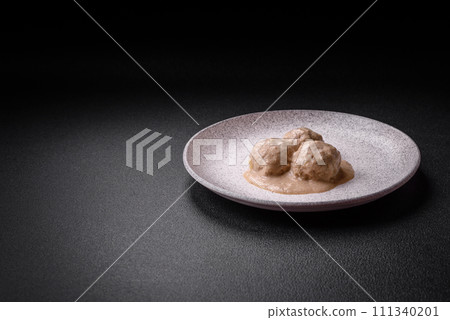 Delicious meatballs from minced chicken or turkey with sour cream sauce Delicious meatballs from minced chicken or turkey with sour cream sauce 111340201