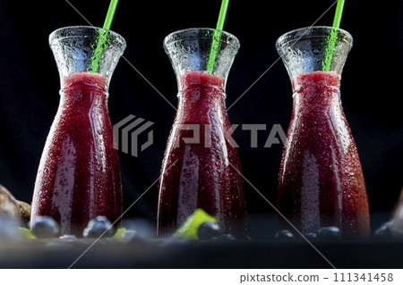 Smoothies with Beetroot, blueberries and mint in glass jar with fruits and vegetables on the wooden table. Detox, diet, healthy, vegetarian drink concept 111341458