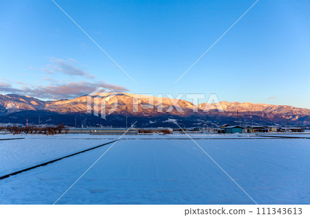 Sunrise on Mt. Kushigata the morning after a heavy snowfall, Minami Alps City Sunrise on Mt. Kushigata the morning after a heavy snowfall, Minami Alps City 111343613
