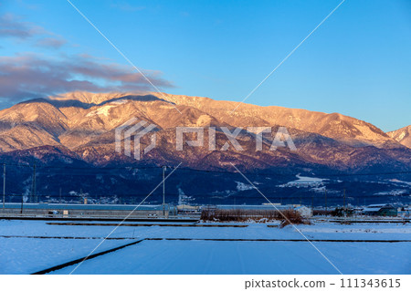 Sunrise on Mt. Kushigata the morning after a heavy snowfall, Minami Alps City Sunrise on Mt. Kushigata the morning after a heavy snowfall, Minami Alps City 111343615