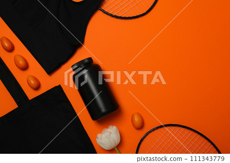 Sportswear with flowers on an orange background. 111343779