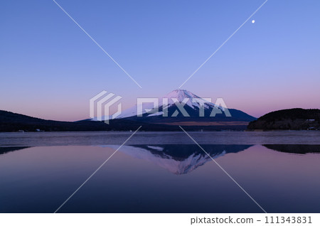 Upside down Fuji and the moon seen from Lake Yamanaka at dawn in Yamanashi Prefecture Upside down Fuji and the moon seen from Lake Yamanaka at dawn in Yamanashi Prefecture 111343831