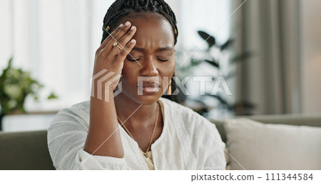 Headache, stress and young black woman in the living room of her modern apartment on weekend. Burnout, mental health and sick African female person with migraine for illness in lounge at home. 111344584