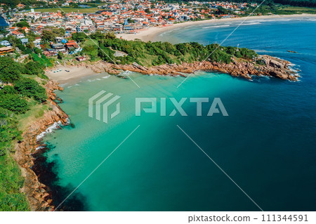 Beach with rocks and ocean in Brazil. Drone view of coastline beach in Florianopolis 111344591