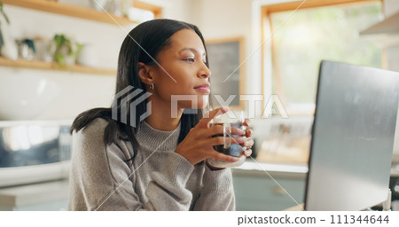 Laptop, coffee and freelance with a woman entrepreneur in the kitchen of her home for small business. Computer, report or email with a young female employee remote working on a startup from her house 111344644