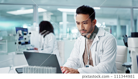 Tablet, scientist and typing on laptop in laboratory, healthcare and online research for medicine with analysis. Asian expert, computer and reading on clinical trials and information for innovation Tablet, scientist and typing on laptop in laboratory, healthcare and online research for medicine with analysis. Asian expert, computer and reading on clinical trials and information for innovation 111344981