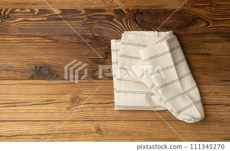 Kitchen Napkin Mockup, Striped Towel on Wooden Table with Copy Space for Text, Tablecloth Banner 111345270