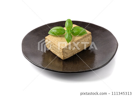 Tofu Cheese Isolated, Smoked Vegan Cheese Slice, Sliced Soya Bean Curd, Soy Protein or TSP Tofu Cheese Isolated, Smoked Vegan Cheese Slice, Sliced Soya Bean Curd, Soy Protein or TSP 111345313