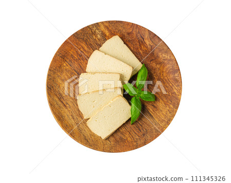 Tofu Cheese Isolated, Smoked Vegan Cheese Slice, Sliced Soya Bean Curd, Soy Protein or TSP Tofu Cheese Isolated, Smoked Vegan Cheese Slice, Sliced Soya Bean Curd, Soy Protein or TSP 111345326