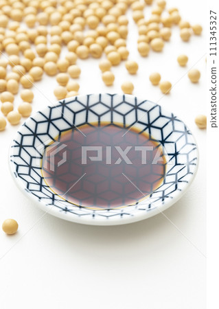 soy sauce and soybeans on white background 111345327