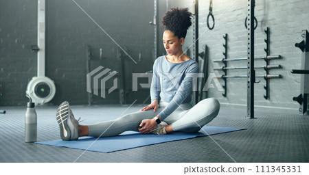 Black woman, gym and stretching, fitness and exercise motivation and body training for sport and health. Healthy, wellness and preparing for workout, warm up and stretch for active lifestyle. Black woman, gym and stretching, fitness and exercise motivation and body training for sport and health. Healthy, wellness and preparing for workout, warm up and stretch for active lifestyle. 111345331