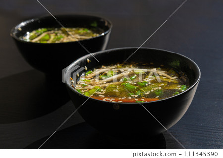 Fish Broth with Greens, Sesame Seeds and Herbs Fish Broth with Greens, Sesame Seeds and Herbs 111345390