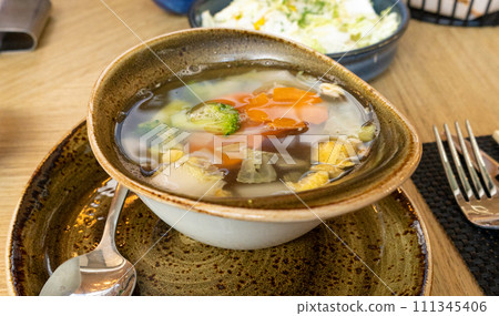 Vegetable Soup, Healthy Vegetarian Meal, Diet Dinner, Transparent Vegetable Broth with Carrots 111345406