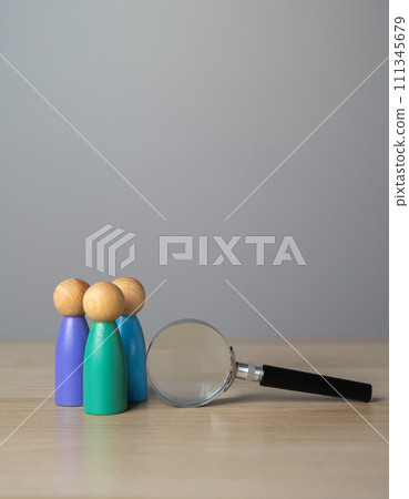 People figurines and magnifying glass. Diversity or unity. Exploration, introspection, and the desire to delve into the intricacies of the human experience 111345679