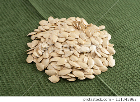 Whole Pumpkin Seeds in Shell Isolated, Raw Pepita Grains, Scattered Green Healthy Nuts 111345962