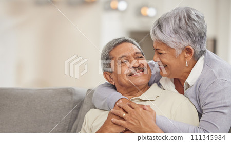 Relax, retirement and senior Mexico couple on sofa at home enjoying free time with smile, hug and love. Happy, comfortable and relationship of elderly man and woman on couch in living room together Relax, retirement and senior Mexico couple on sofa at home enjoying free time with smile, hug and love. Happy, comfortable and relationship of elderly man and woman on couch in living room together 111345984