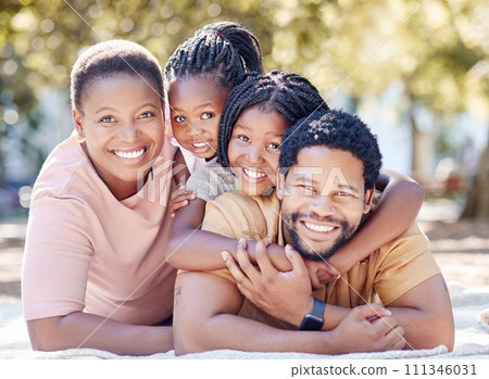 African family smile at the park, having fun in summer sunshine and enjoying nature on holiday. Black African man, woman and children smiling. Kids hug dad, to bond with parent in garden African family smile at the park, having fun in summer sunshine and enjoying nature on holiday. Black African man, woman and children smiling. Kids hug dad, to bond with parent in garden 111346031