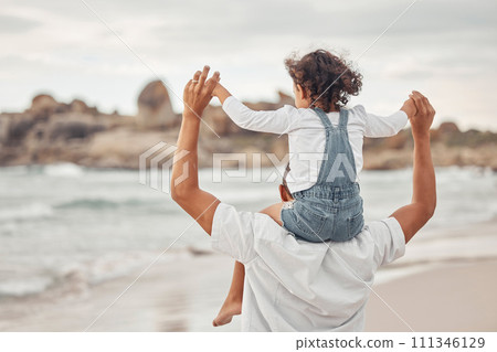 Beach water, dad and child on family holiday together for a fun summer break to bond in nature. Happy father and kid enjoy ocean vacation with young girl holding parent for balance on shoulders. 111346129