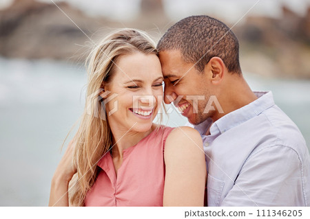 Love, happy and hug with couple together for romance, relationship and lifestyle on beach holiday trip. Happiness, care and support with man and woman in embrace on summer vacation date by the sea 111346205