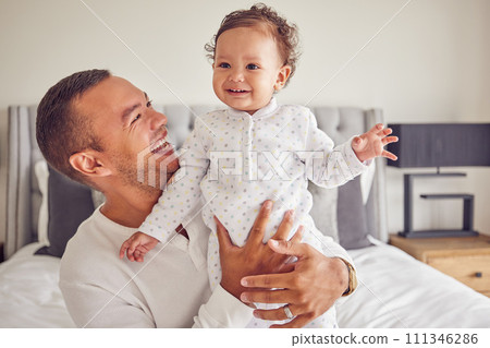 A happy dad and baby with smile on the bed at home, having fun and laughing together. Portrait of man bonding, smiling and playing with kid in bedroom. Family, love and care from father 111346286