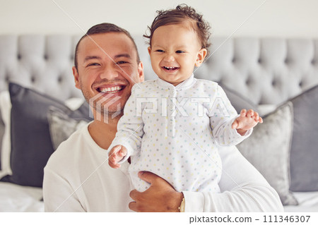 Happy father smile with baby, on bed in cute moment together in house or apartment in the morning. Excited new dad with young child, show expression of happiness and care in bedroom at family home 111346307