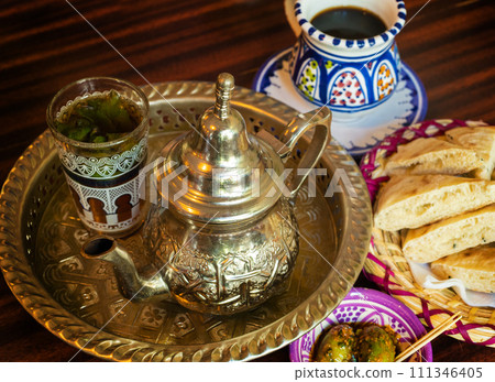 Moroccan Mint Tea in Teapot and Glass 111346405