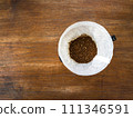 Prepared coffee grounds in the filter paper and dripper. Ready to brew by hand pouring method. 111346591