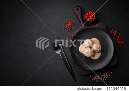 Delicious meatballs from minced chicken or turkey with sour cream sauce Delicious meatballs from minced chicken or turkey with sour cream sauce 111346929