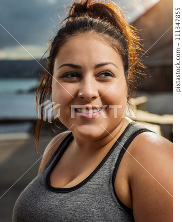 Plump woman talking with a smile 111347855