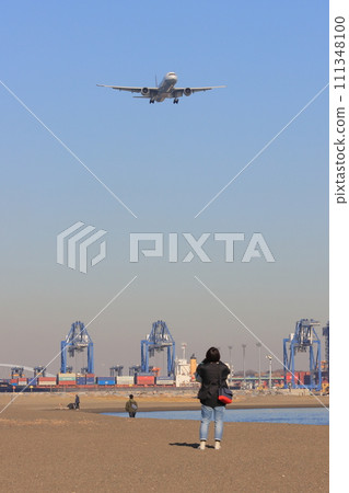 Passenger plane flying overhead; Passenger plane approaching for landing Passenger plane flying overhead; Passenger plane approaching for landing 111348100