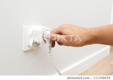 Smart plug into the socket. Electricity expenses Smart plug into the socket. Electricity expenses 111348459