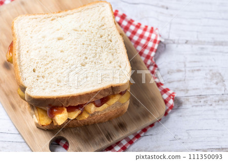 Sliced white bread on wooden table Sliced white bread on wooden table 111350093