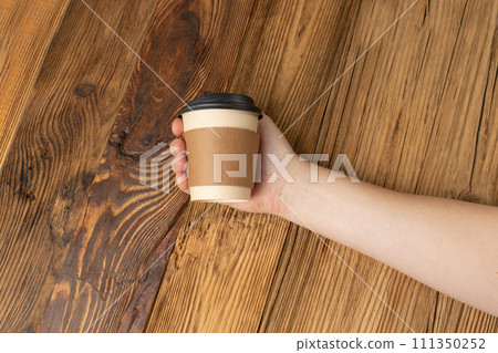 Hand Holds Cup, Empty Paper Cup in Hands, Coffee Mug, Teacup, Hot Beverage Mockup, Cup in Arms Hand Holds Cup, Empty Paper Cup in Hands, Coffee Mug, Teacup, Hot Beverage Mockup, Cup in Arms 111350252