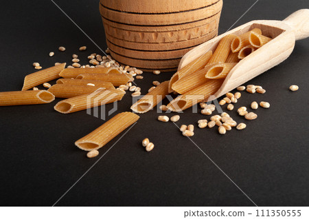 Raw Brown Pasta, Wholegrain Penne, Dry Whole Grain Noodle, Raw Spelt Macaroni, Healthy Italy Food 111350555