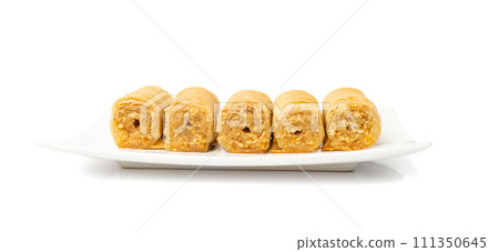 Rolled Baklava Isolated, Ramadan Dessert Roll on Restaurant Plate, Eastern Sweet Pastries 111350645