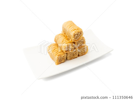 Rolled Baklava Isolated, Ramadan Dessert Roll on Restaurant Plate, Eastern Sweet Pastries 111350646