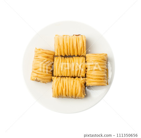 Rolled Baklava Isolated, Ramadan Dessert Roll on Restaurant Plate, Eastern Sweet Pastries 111350656