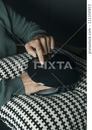 caucasian man using a hand massager 111350953