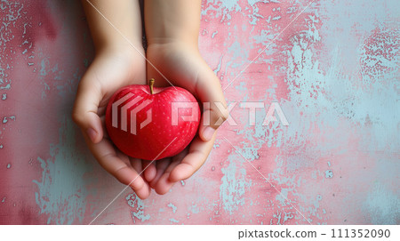 Hands Cradling a Fresh Red Apple 111352090